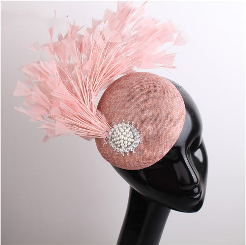 pink darby hat with feather and brooch
